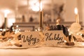 Wifey and Hubby decorations put on the Thanksgiving dinner table on blurred background