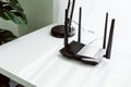 Wifi and broadband router on white table in room at the home. Royalty Free Stock Photo