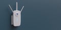 WiFi extender, wireless repeater isolated on blue wall. Internet booster, white, close up. 3d render Royalty Free Stock Photo