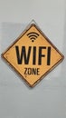 Wifi free zone announcement hang on painted wall Royalty Free Stock Photo