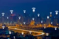 Wifi network connection concept on aerial view of cityscape business district at twilight background.