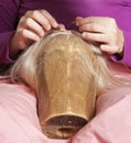 Wig Maker Working in her Workshop. Royalty Free Stock Photo