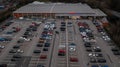 Wigan, UK: March 10, 2022: Aerial image over the Tesco Extra store and car park at the retail park.