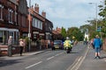 WIGAN, UK 14 SEPTEMBER 2019: A photograph documenting police advance riders creating clear roads for the Tour of Britain race in