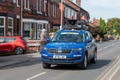 WIGAN, UK 14 SEPTEMBER 2019: A photograph documenting a race support vehicle leading the Tour of Britain 2019 race as it passes