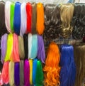 Wigs in different colours on display