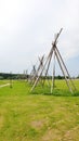 Wigwams made of sticks on the green grass Royalty Free Stock Photo