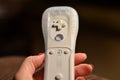 Wii remote technology and hand.