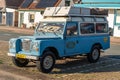 Classic off-road vehicle Land Rover 109 pick up, Series III from 1981 in blue colour