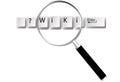 Wiki keys magnifying glass information Royalty Free Stock Photo