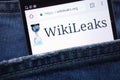 WikiLeaks website displayed on smartphone hidden in jeans pocket Royalty Free Stock Photo