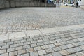 Wil, SG / Switzerland - April 8, 2019: cobblestone road leading from the old town of Will down into the new city with traffic and