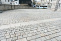 Wil, SG / Switzerland - April 8, 2019: cobblestone road leading from the old town of Will down into the new city with traffic and