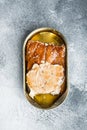 Wild Alaska Salmon Canned smoked fish, in tin can, on gray background, top view flat lay