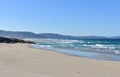 Wild Atlantic Ocean beach with furious sea, waves breaking and blue sky. Arteixo, CoruÃÂ±a, Galicia, Spain.