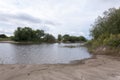 Summer landscape, lake shore wild beach