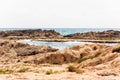 Remote wild beach with cliffs and rocks inside the Mediterranean Sea in North Israel near Rosh Hanikra Royalty Free Stock Photo