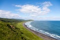 Wild beach made of volcanic sand on the Pacific Ocean, Kamchatka Peninsula, Russia. Royalty Free Stock Photo