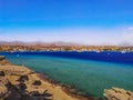 Wild Beach in Sharm El-Maya Bay in Sharm El Sheikh Egypt. Beautiful sea panorama with turquoise-blue-azure water and the Sinai