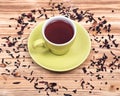 Wild berry tea in green cup with hibiscus leafs Royalty Free Stock Photo