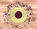 Wild berry tea in green cup with hibiscus leafs Royalty Free Stock Photo