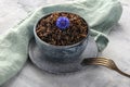 Wild black rice with an edible flower, a blue cornflower, with a fork Royalty Free Stock Photo