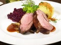 Wild Boar Loin Steak with red Cabbage and Potato Dumpling Royalty Free Stock Photo