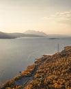 Wild camping with campervan at road along lake and mountains in Stora SjÃ¶fallet National Park in autumn in Lapland