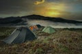 Wild Camping in the Scottish Mountains above the clouds at sunset