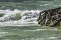 Wild and choppy river current breaking over rocks, aquamarine wa