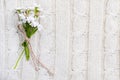 Wild flowers on a beige knitted texture