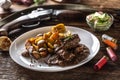 Wild game goulash stew served with roasted potatoes and seasoned with four colour pepper corn. Whole food is surrounded by hunting Royalty Free Stock Photo