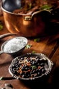 Wild Game Meat Rub Next to Pot on Wooden Table