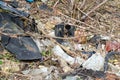 Wild garbage dump. residual glass, plastics in the forest Royalty Free Stock Photo