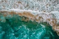Wild high waves of Atlantic Ocean,turquise water,sandy beach in Portugal.Summer vacation travel concept.Top down view.Aerial view