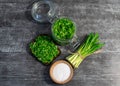 Wild leek pesto on a slice of bread with olive oil and salt on a wooden table with bread. Useful properties of wild garlic. Fresh Royalty Free Stock Photo