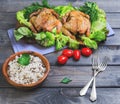 Wild and long grain white rice in a wooden bowl, two baked chick Royalty Free Stock Photo