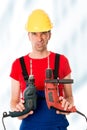 Wild man with helmet and drilling machine Royalty Free Stock Photo
