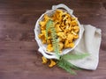 Wild mushroom chanterelle on wooden table top view Royalty Free Stock Photo