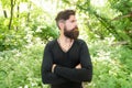 Wild nature. Man bearded hipster bright foliage background. Guy relax in forest. Exploring nature. Handsome man with