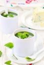 Wild nettle cream soup with blue cheese .