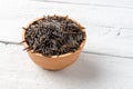 Wild rice in bowl on vintage wooden table Royalty Free Stock Photo