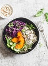 Wild rice, roasted pumpkin, red cabbage buddha bowl. Vegetarian food concept. On a light background Royalty Free Stock Photo