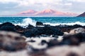 Wild rocky coastline of Fuerteventura and Lanzarote, Canary Islands, Spain. Playa Blanca on Lanzarote with volcano