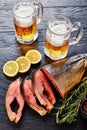 Wild salmon cut in steaks and beer Royalty Free Stock Photo