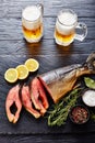 Wild salmon cut in steaks with foamed beer Royalty Free Stock Photo