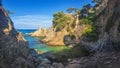 Wild seascape of bay in Mediterranean sea on clear sunny day. Amazing view of rocky shores against blue sky and coastline Royalty Free Stock Photo