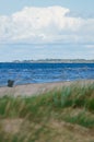 Wild seashore of the Baltic Sea with foam waves