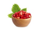 Wild small strawberries in a wooden bowl with leaves Royalty Free Stock Photo