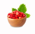 Wild small strawberry in a wooden bowl Royalty Free Stock Photo